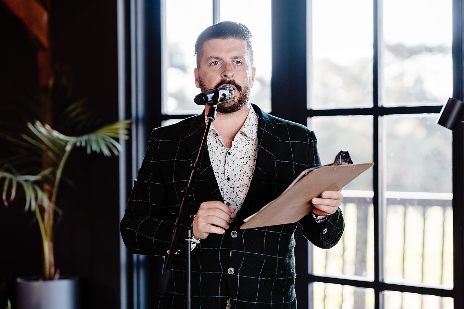Corporate master of ceremonies hosting a Melbourne event with microphone